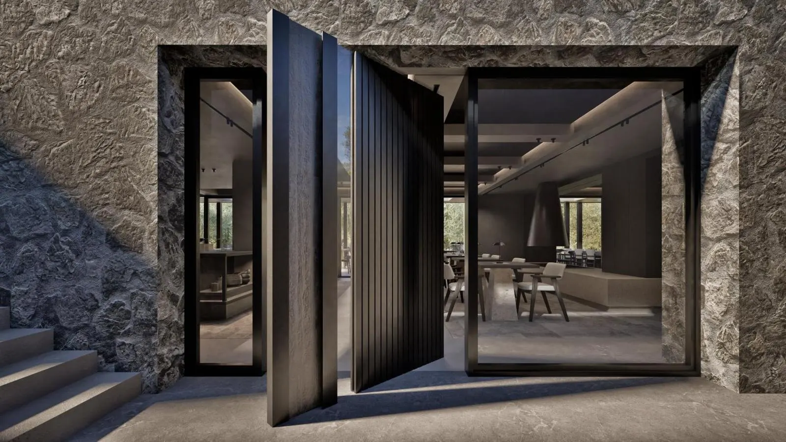 Stone entrance with large pivoting black door