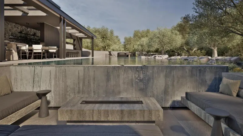 Lounge seating beside concrete pool ledge
