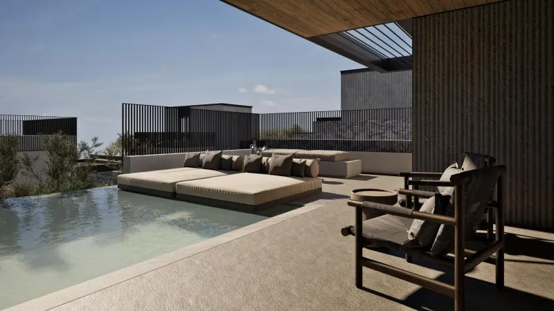 Outdoor daybed and chair by pool edge