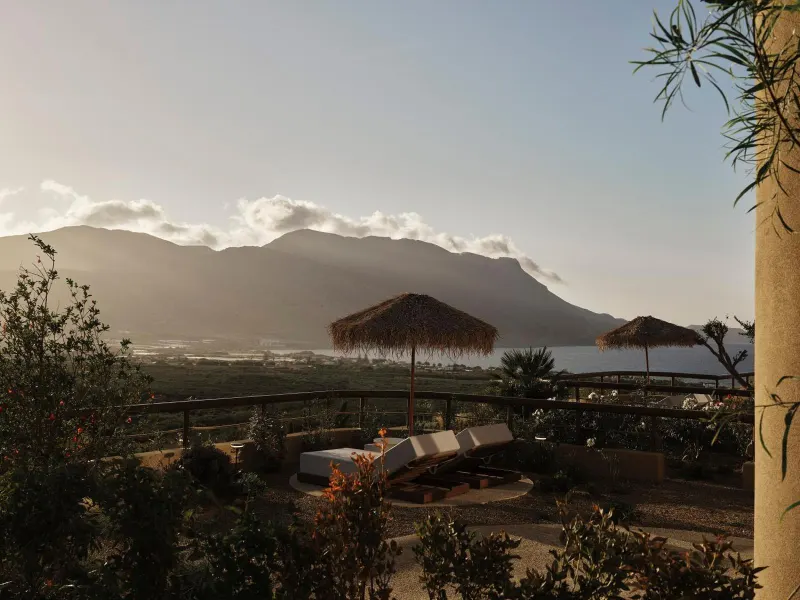 Mountain view over resort gardens at dusk