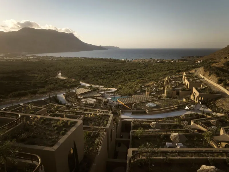 Aerial view of resort terraces beside coastline