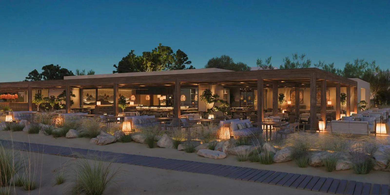 Outdoor dining terrace lit up at dusk