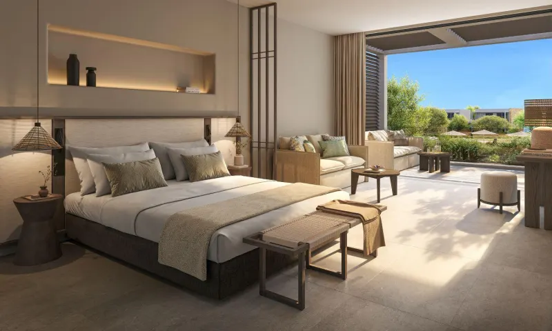 Bedroom with seating area and garden views