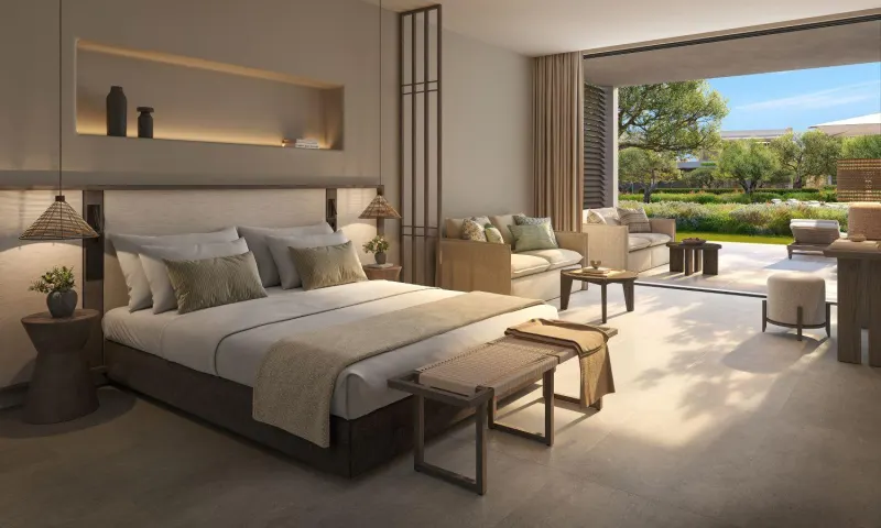 Bedroom with lounge chairs and garden outlook