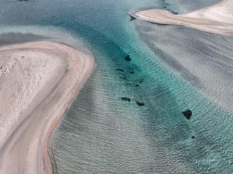 Aerial view of turquoise lagoon and sandbars
