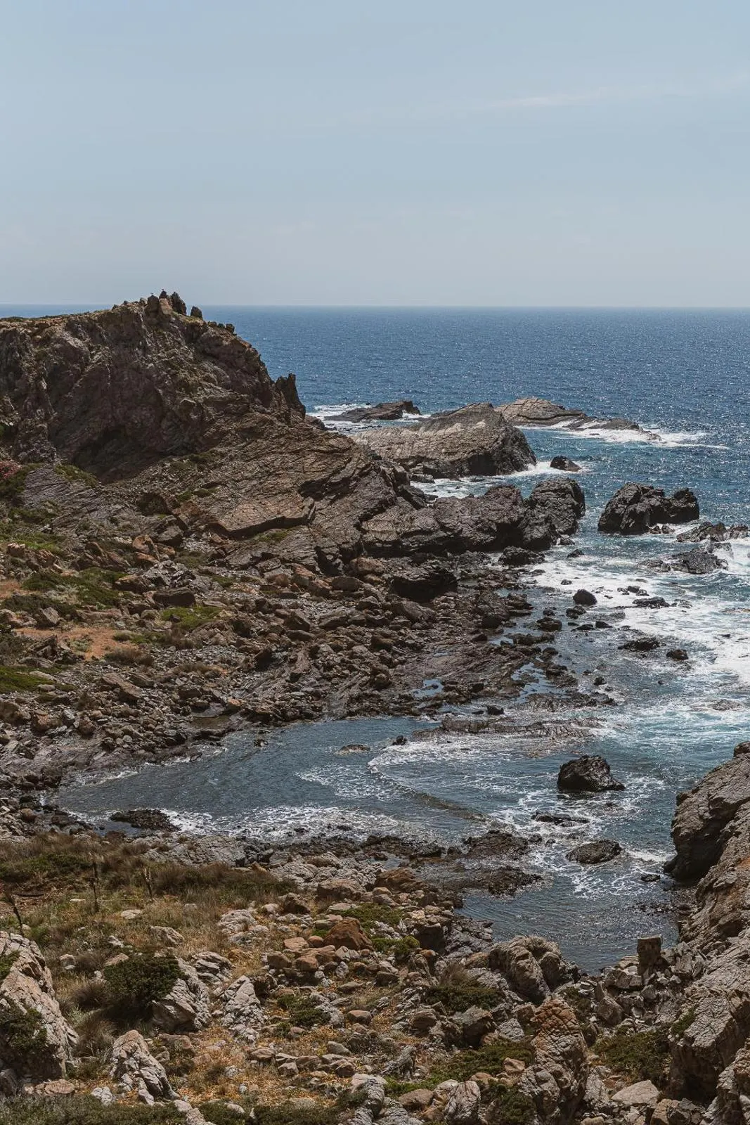 Rocky coastline with waves crashing below cliffs