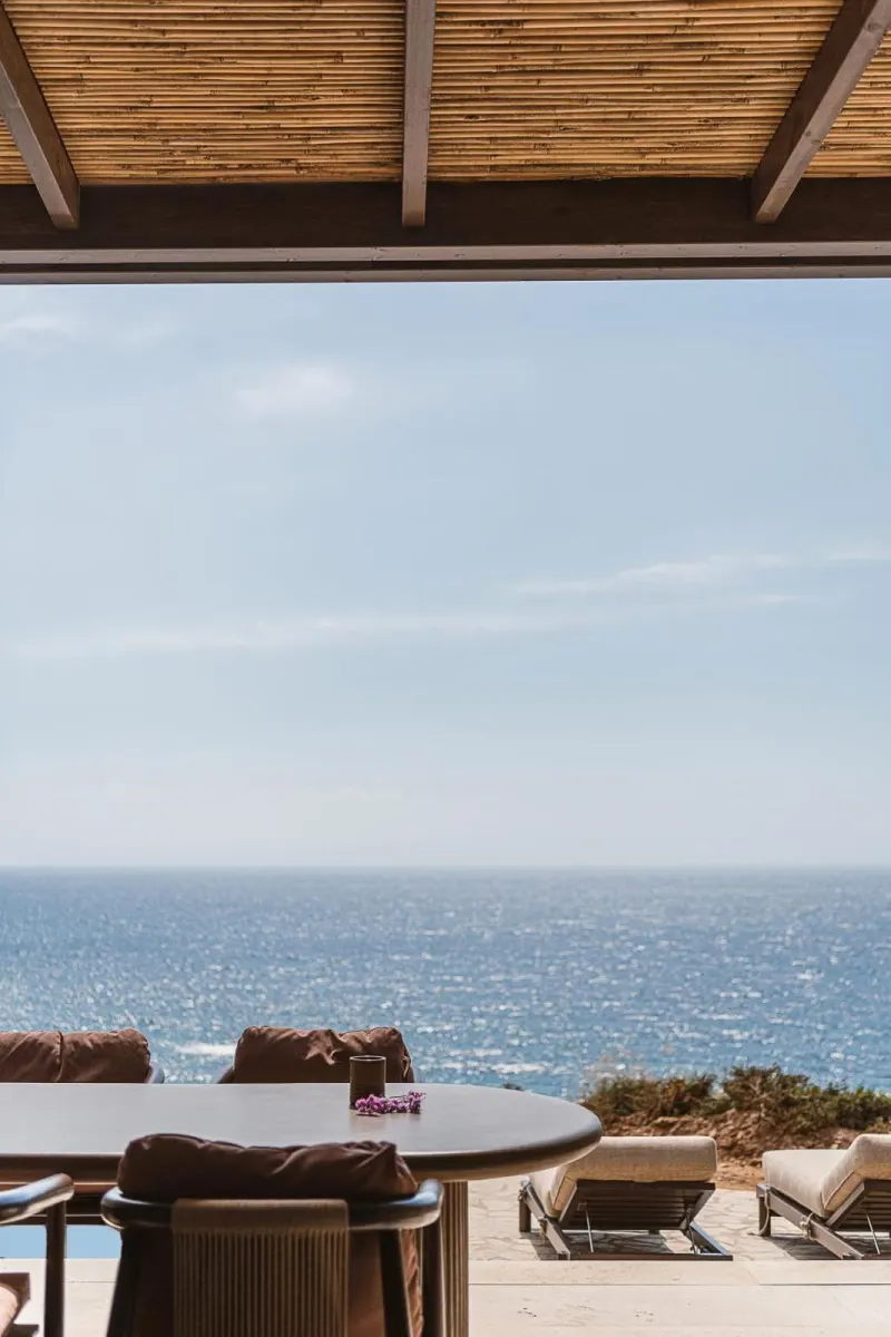 Covered terrace overlooking sparkling ocean horizon