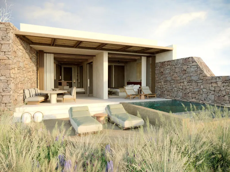 Villa exterior with private pool and stone walls