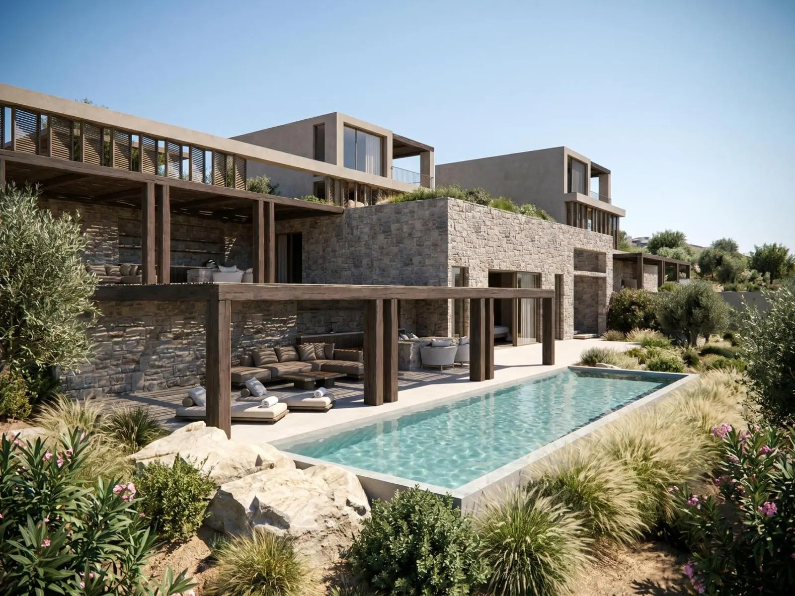 Stone villa exterior with long pool and gardens
