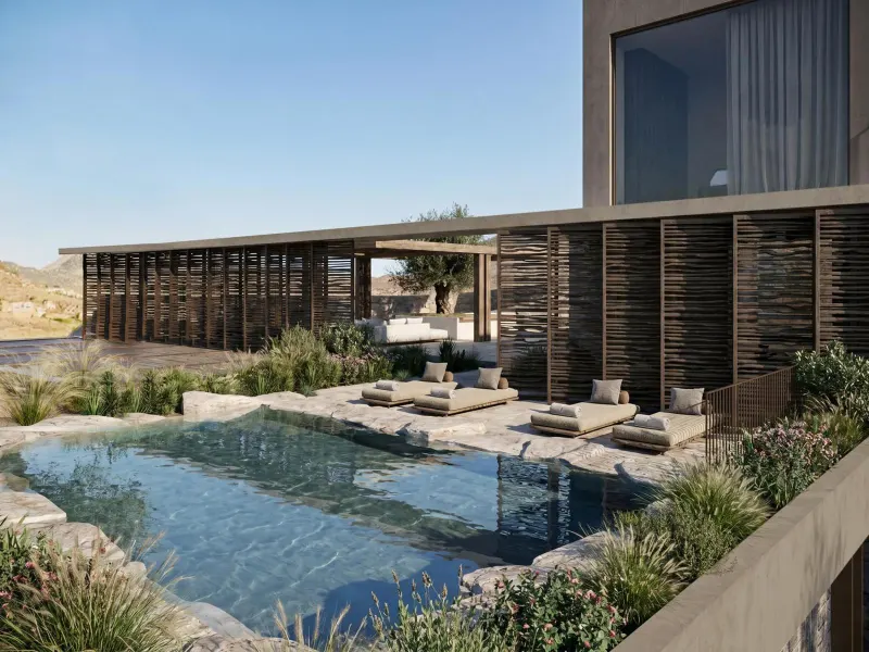 Infinity pool with loungers beside modern villa exterior