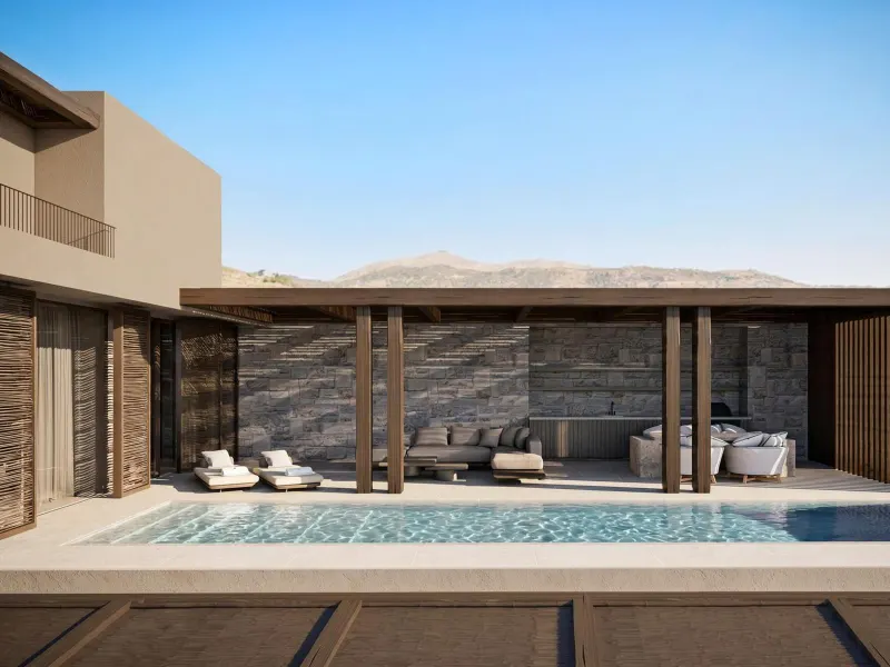 Pool terrace with mountain backdrop and lounge chairs