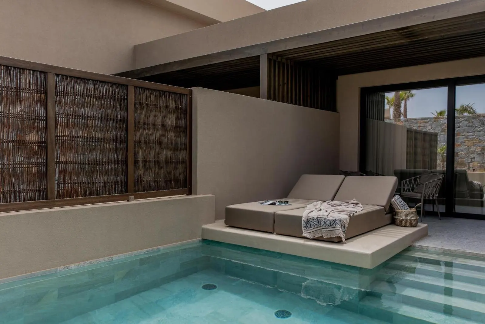 Private plunge pool with daybed and room access