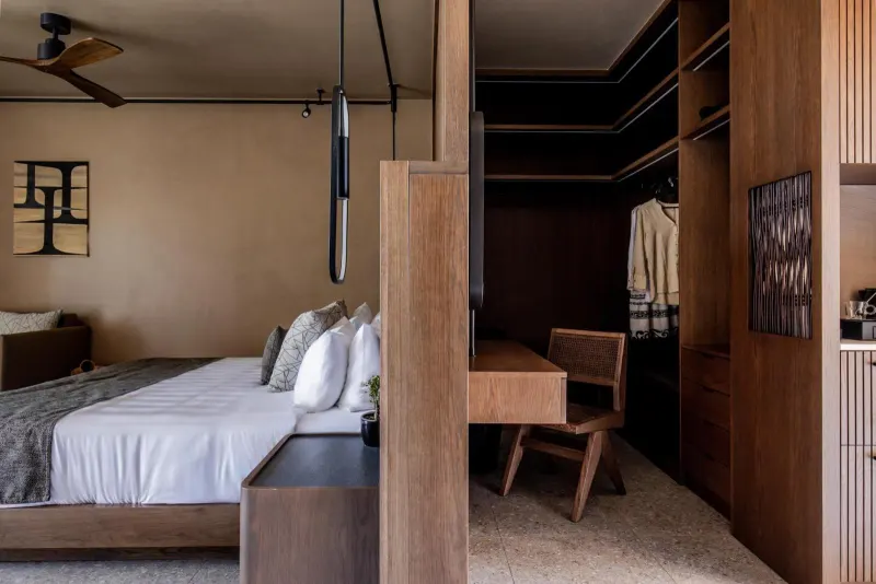 Bedroom leading into wooden walk-in closet
