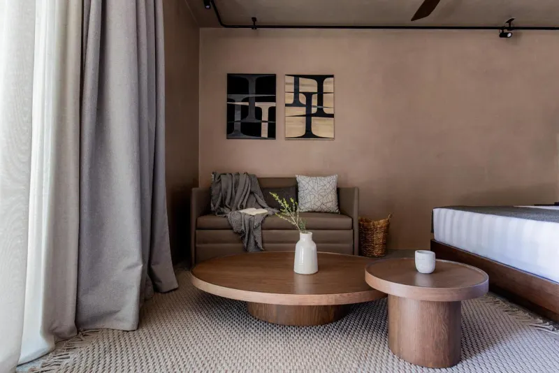 Living area with sofa and round coffee tables