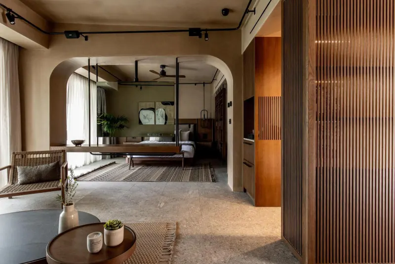 Open suite interior with archway and wooden slats