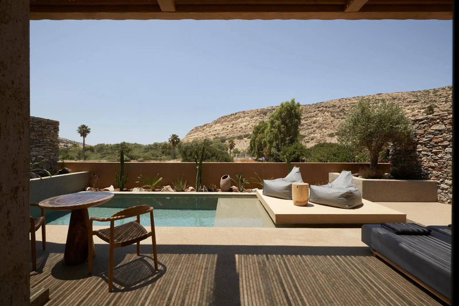 Private pool terrace overlooking arid mountain landscape