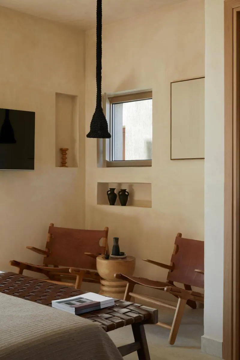 Cozy room nook with leather chairs and pendant light
