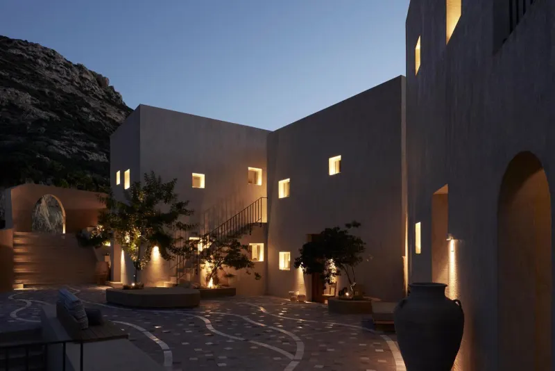 Courtyard illuminated at night with warm lighting