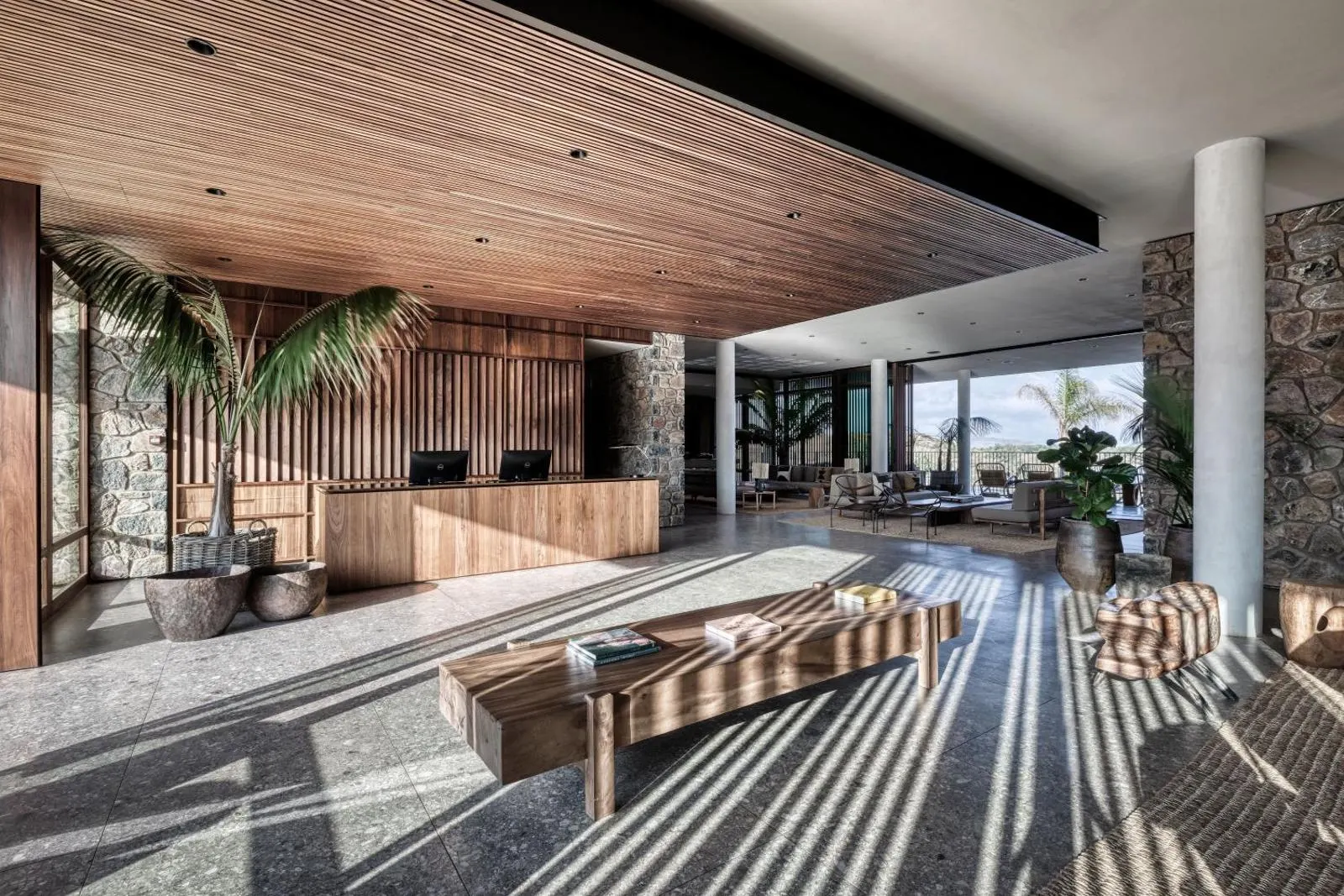 Reception lobby with wooden ceiling and stone walls