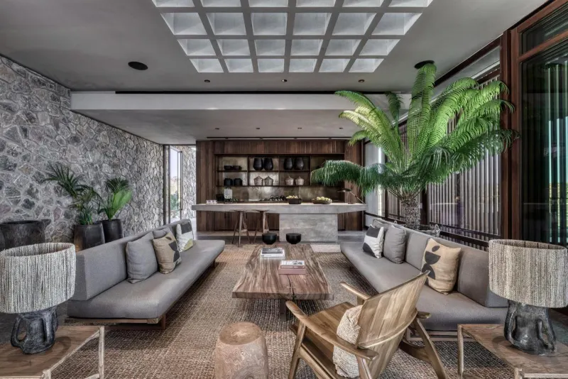 Stylish lounge with stone wall and wooden bar
