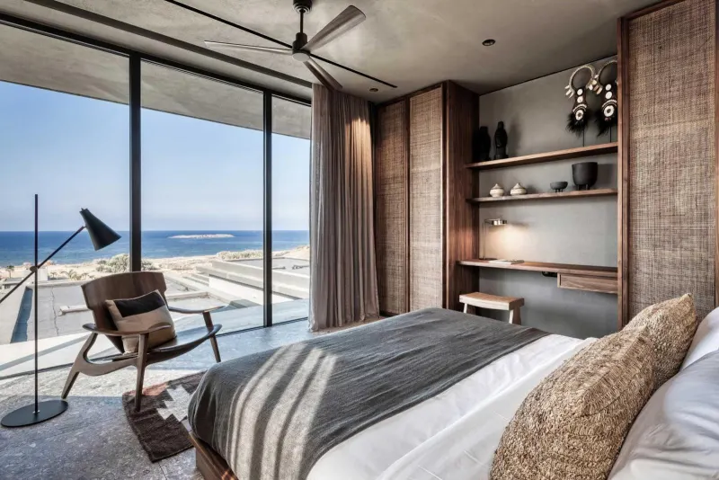Bedroom with ocean view and reading chair