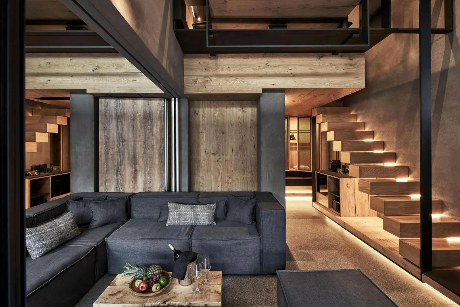 Stylish lounge with wooden beams and staircase