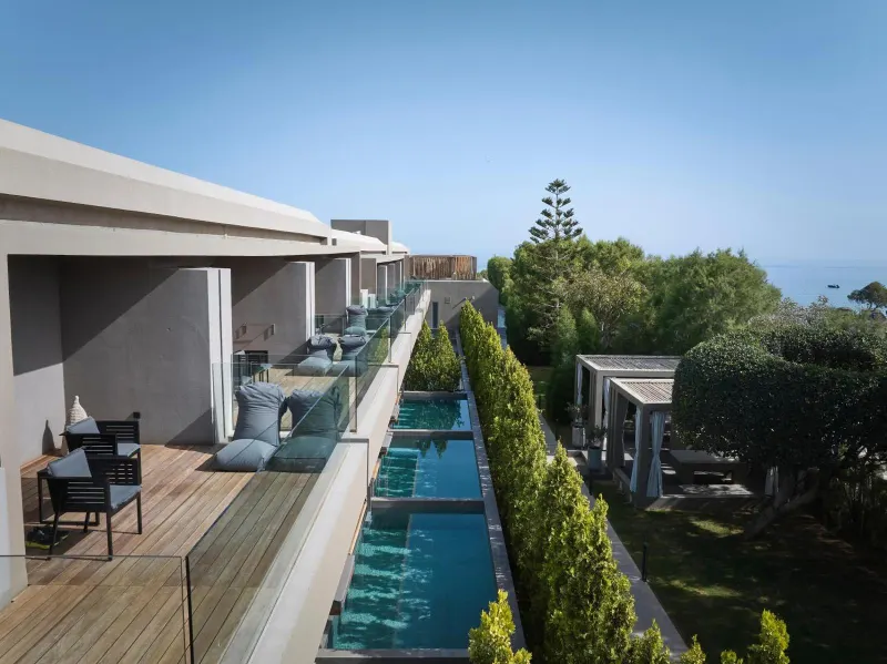 Row of private balcony pools overlooking sea
