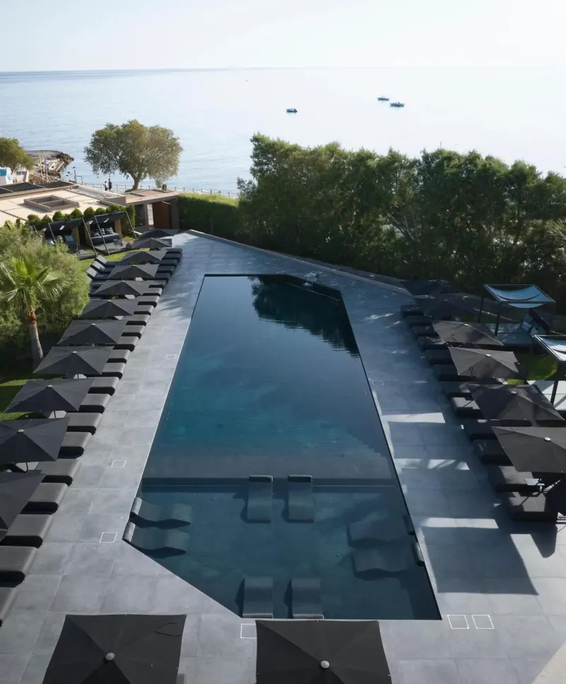 Aerial view of infinity pool by the sea