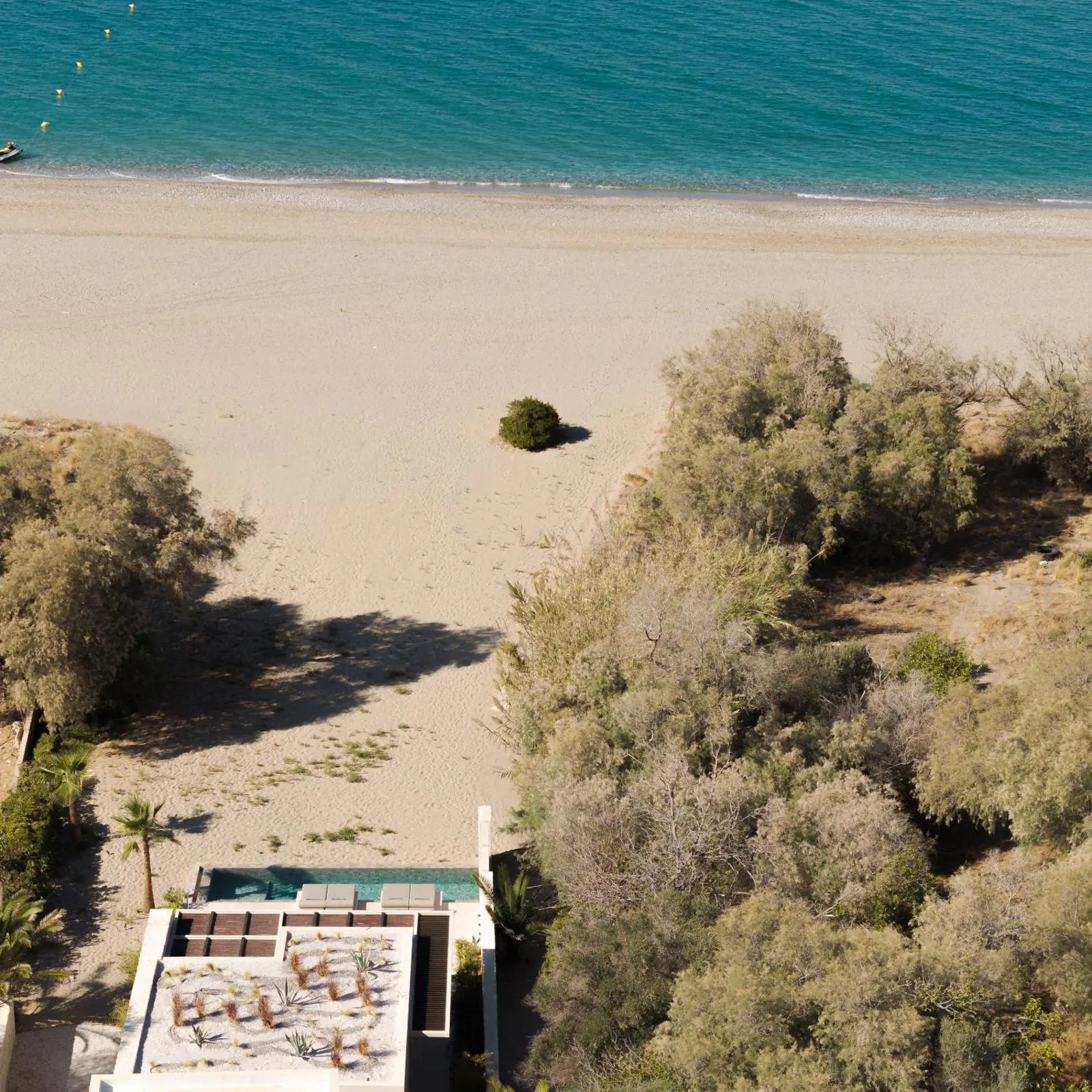 Aerial view of beach path to villa