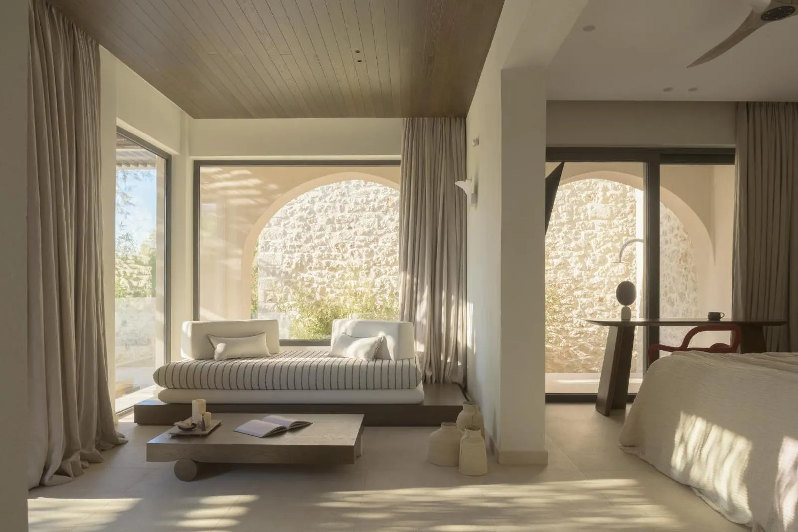 Bright bedroom with daybed and stone view