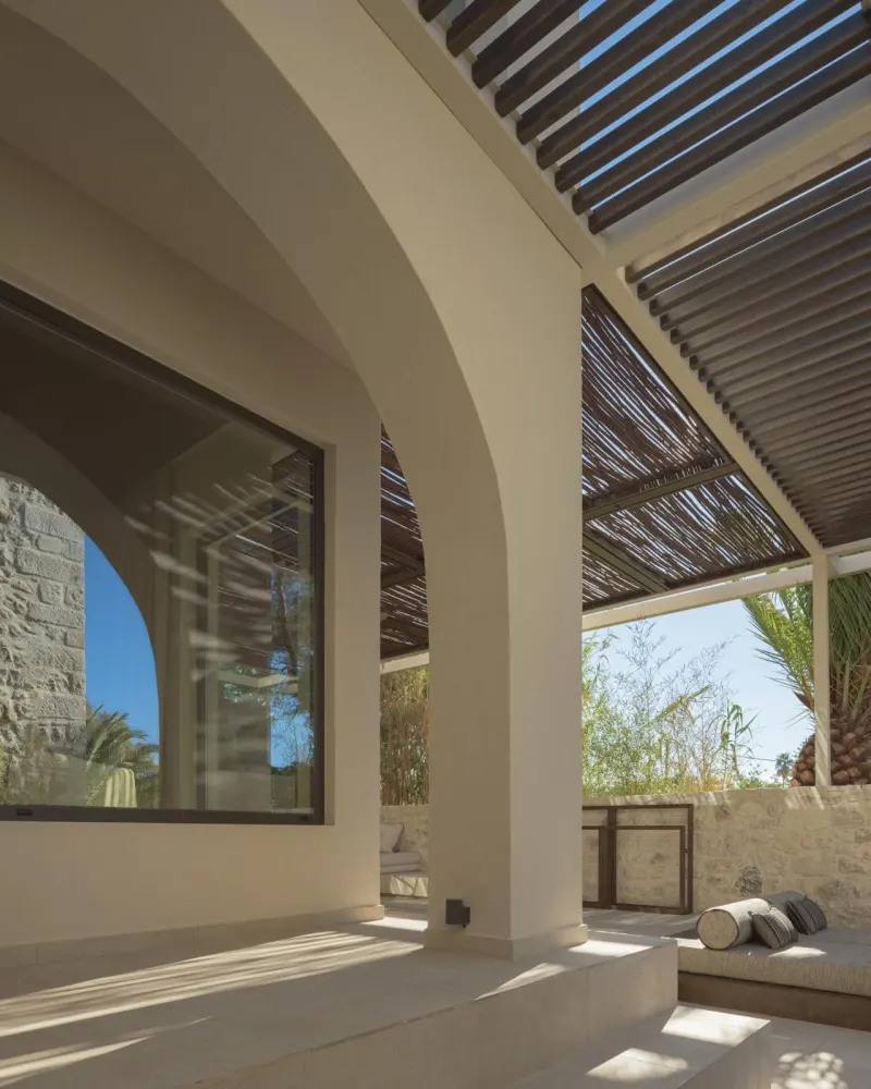Shaded arched porch with stone details