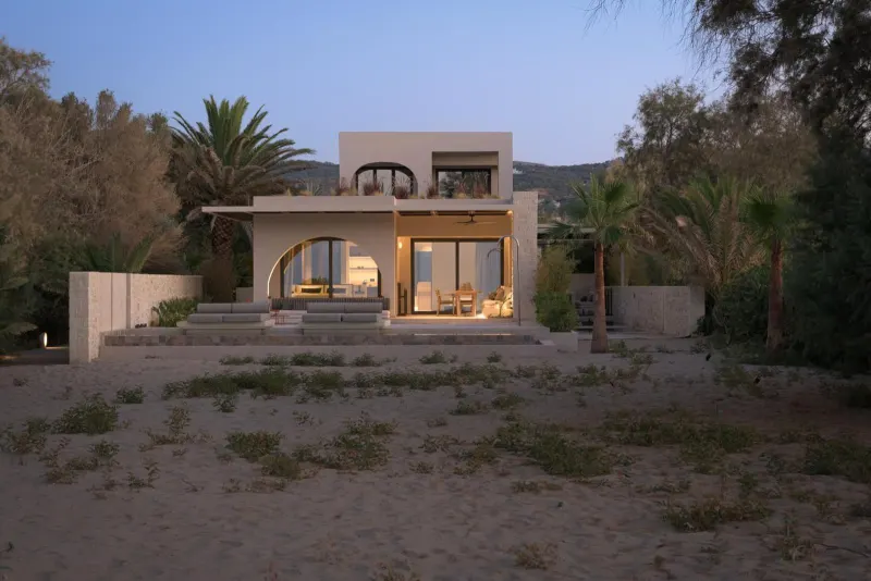 Villa exterior at dusk surrounded by palms