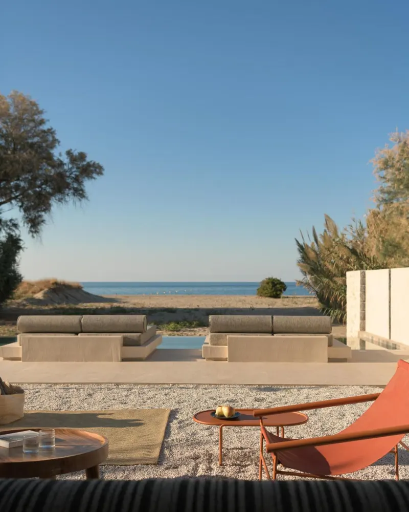 Outdoor lounge facing the beach and sea