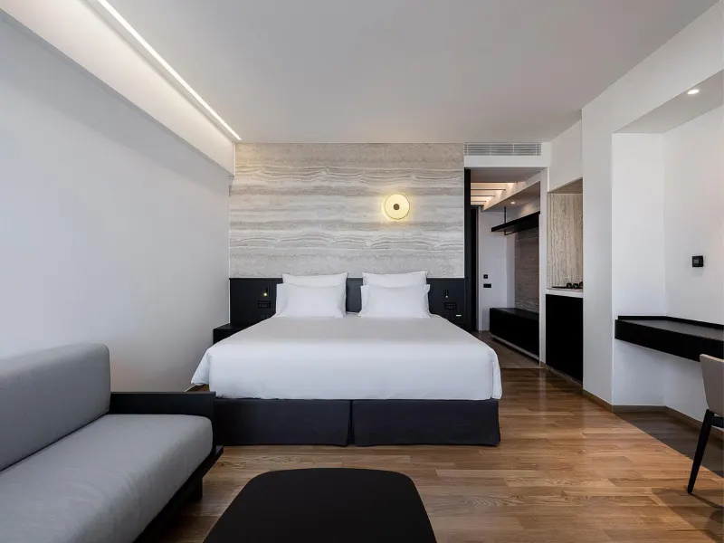 Modern bedroom suite with sofa and bed
