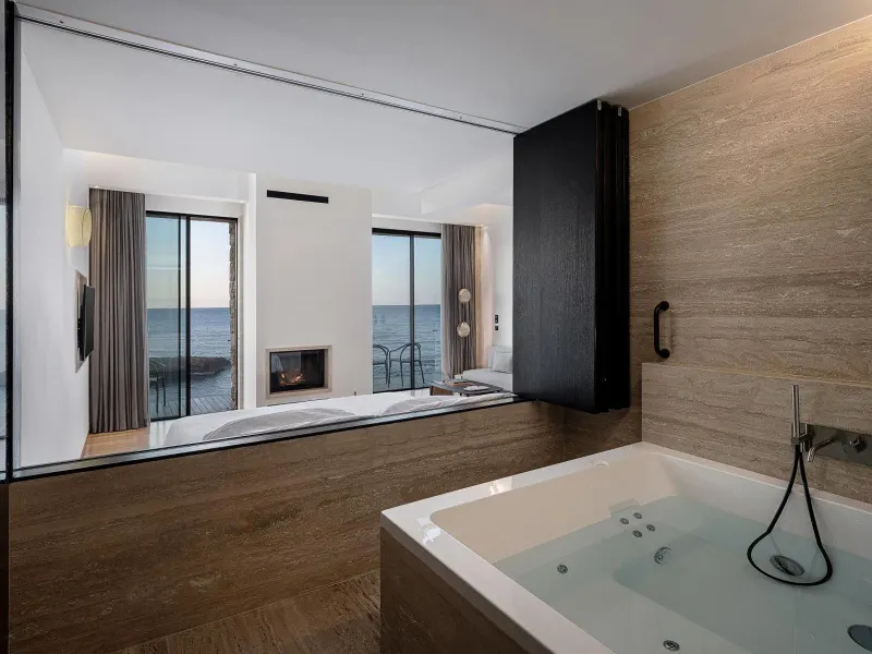 Bathtub with sea view through large window