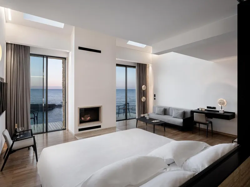Bedroom with fireplace and sea view balcony