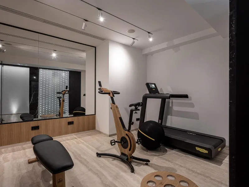 Small hotel gym with exercise equipment