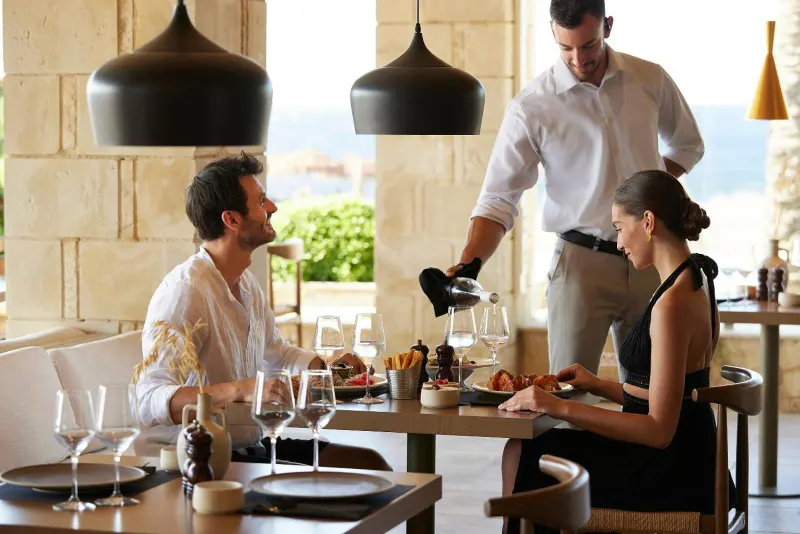 Couple dining at outdoor restaurant table