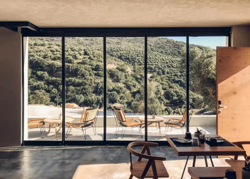 Lounge area with panoramic hillside window view