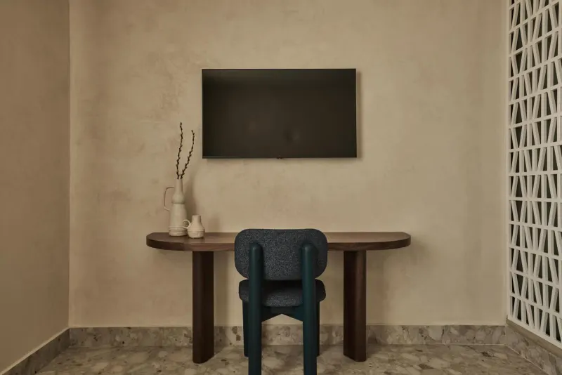 Desk with TV and blue chair
