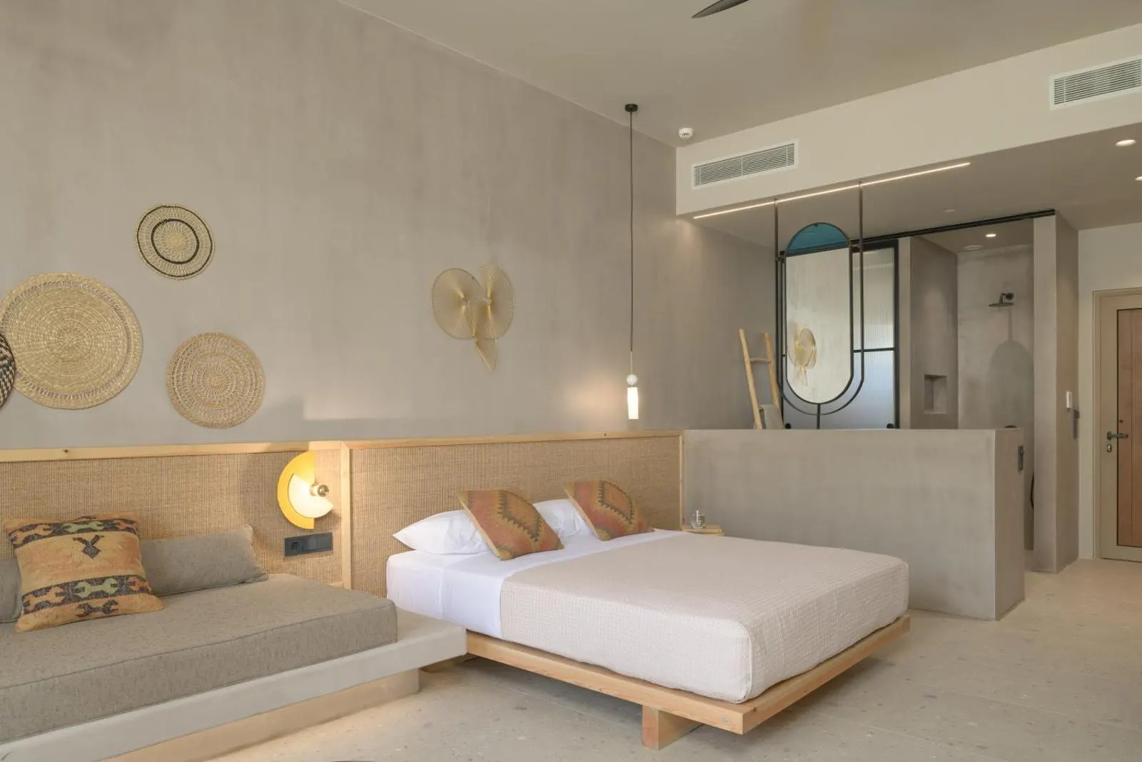 Modern bedroom with bathroom glimpse