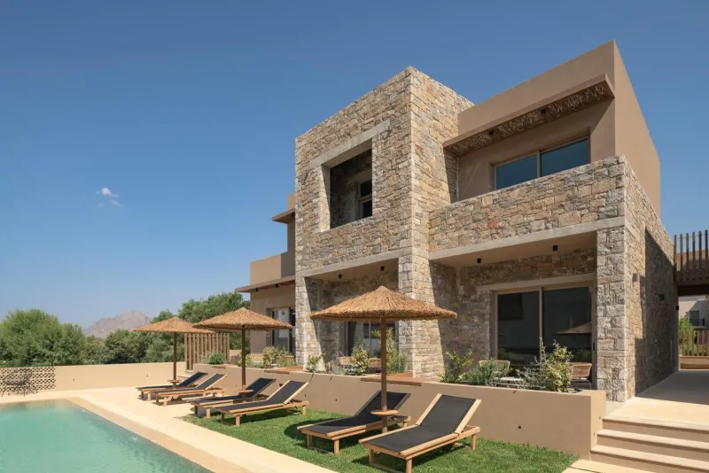 Stone building facade beside pool