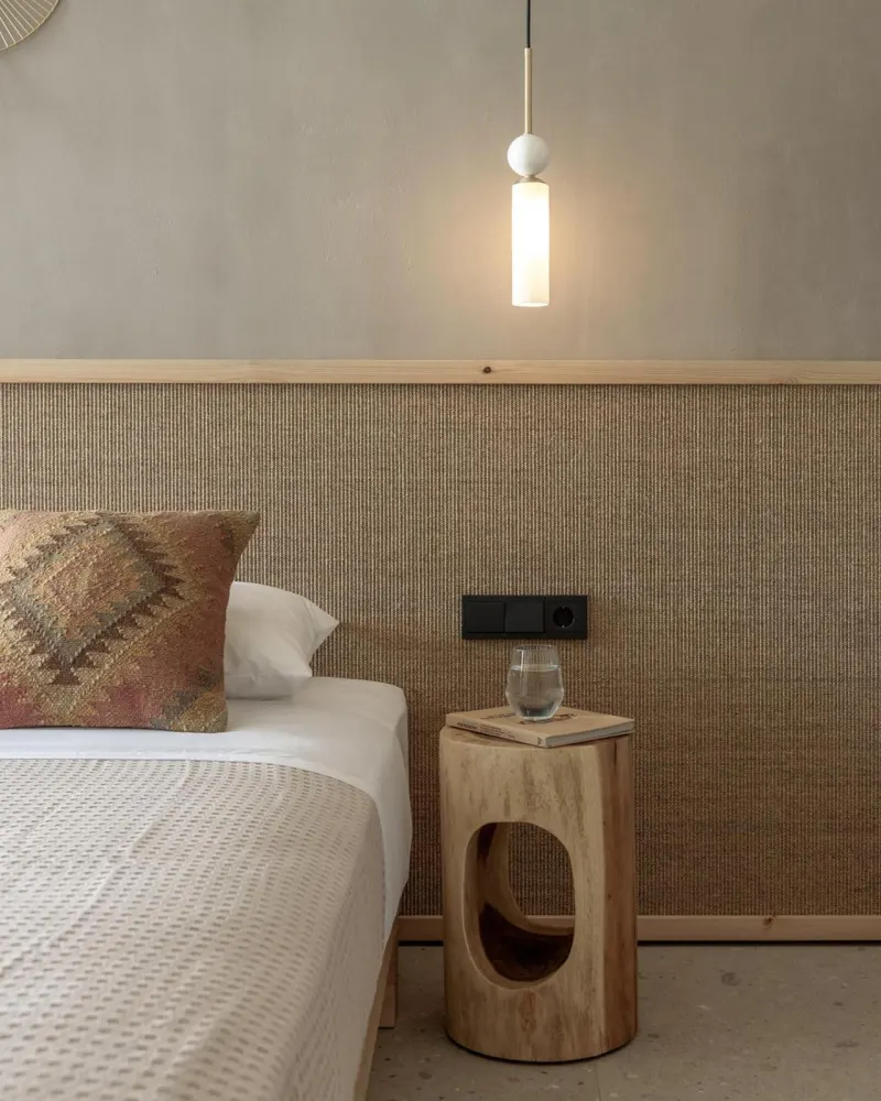 Bed with wooden stool nightstand