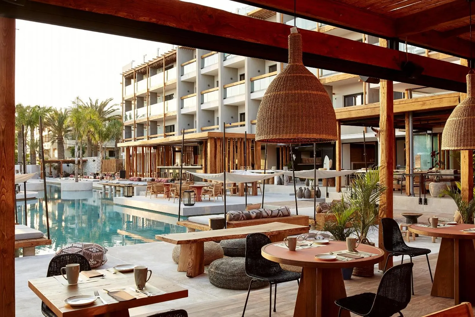 Poolside restaurant terrace with rattan pendant lights