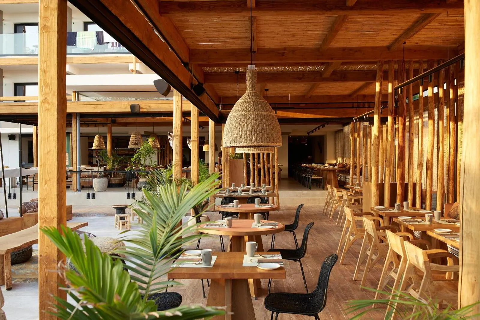 Wooden restaurant terrace with dining tables