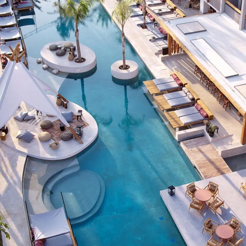Aerial view of hotel pool with lounge seating