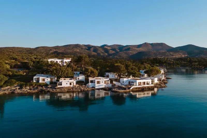 White villas along the shoreline at dusk