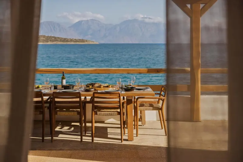Outdoor dining table set with sea view