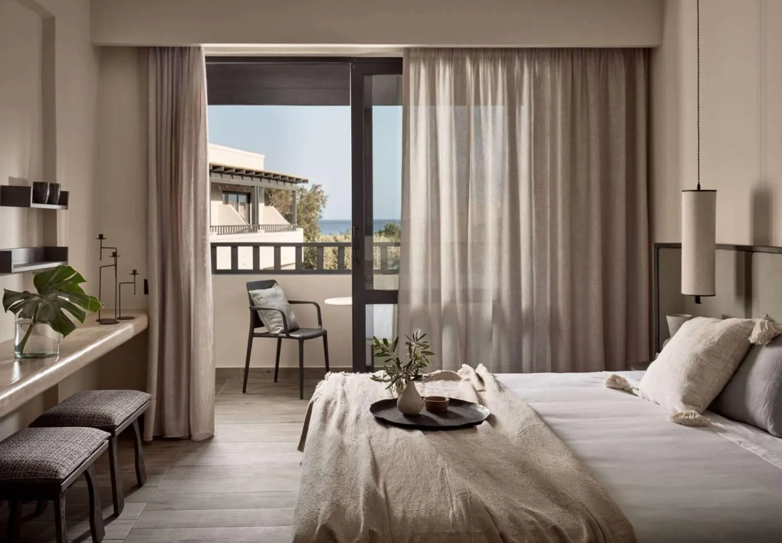 Bedroom with balcony overlooking sea