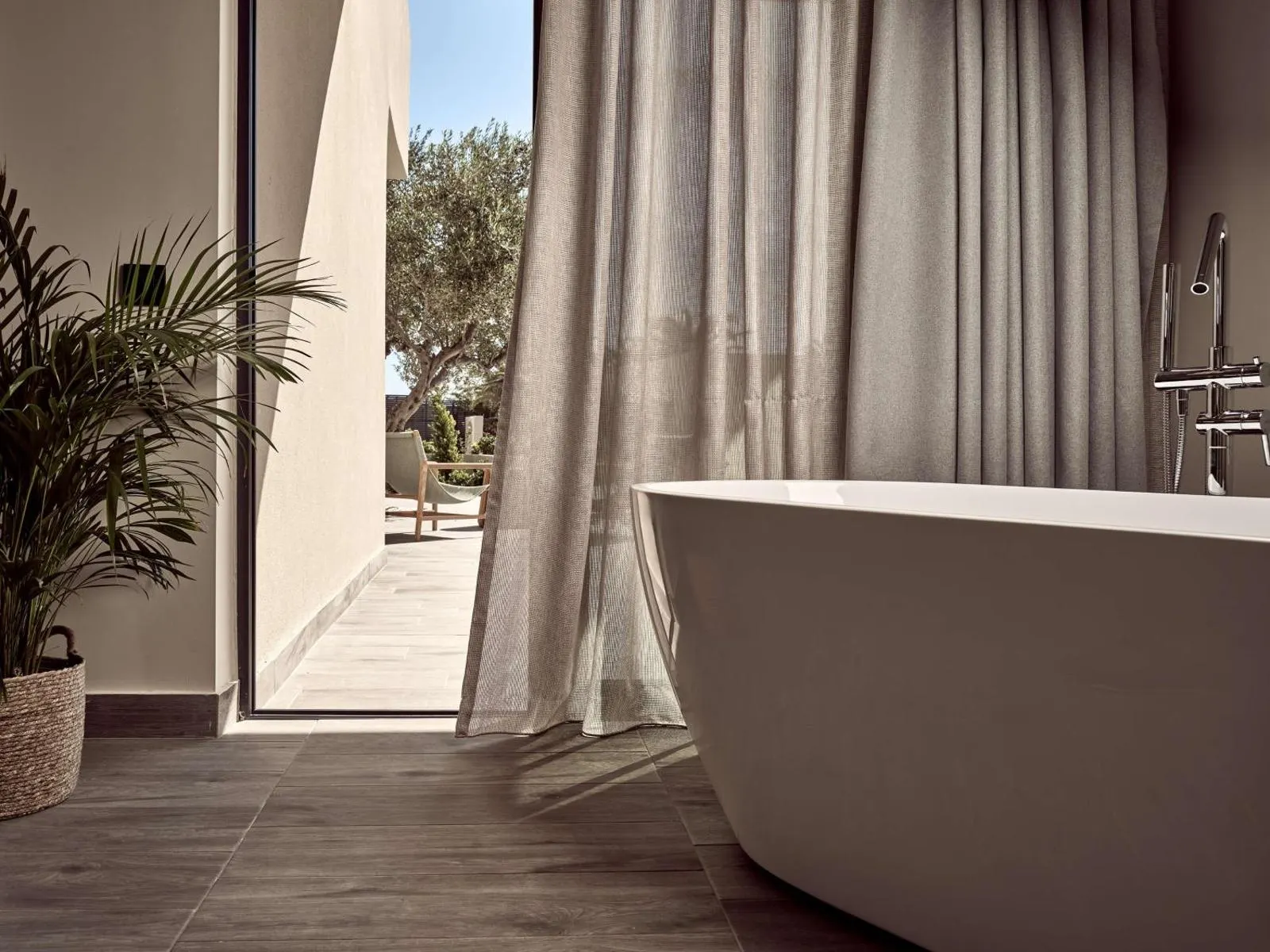 Freestanding bathtub with terrace view